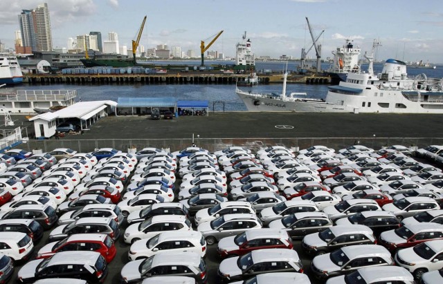 Newly arrived Korean made KIA Sorento SUVs are seen parked at the port of Manila