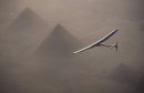 Solar Impulse 2,   the solar powered plane,   piloted by Swiss pioneer Andre Borschberg is seen during the flyover of the pyramids of Giza on July 13,   2016 prior to the landing in Cairo