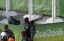 Policemen stand near an overhead television camera that fell in Rio de Janeiro