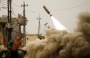 Iraqi rapid response members fire a missile against Islamic State militants during a battle with the militants in Mosul