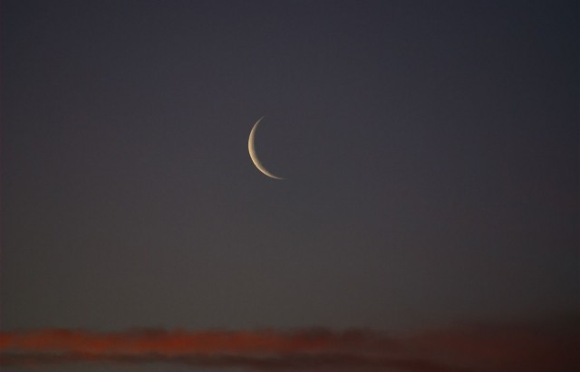 1200px-New_Moon_at_sunset-1