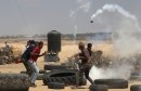 Tear gas canister is fired by Israeli troops towards Palestinian demonstrators during a protest marking the 70th anniversary of Nakba, at the Israel-Gaza border in the southern Gaza Strip