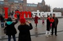 FILE PHOTO: Tourists pose for photos outside the Rijksmuseum in central Amsterdam