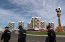 Security officers walk outside the Mordovia Arena in Saransk