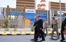 Egyptian President Abdel Fattah Al Sisi walks with Egypt's Electricity Minister Mohamed Shaker during the inauguration of major power stations in the energy sector, at Egypt's new administrative capital