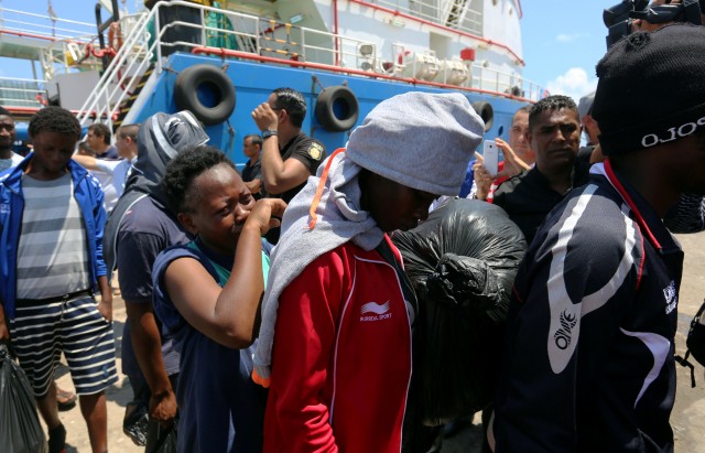 Migrants arrive at a the southern port of Zarzis