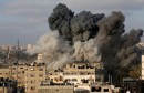Smoke rises after an Israeli aircraft bombed a multi-storey building in Gaza City