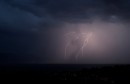 A lightning strikes on Lake Leman during a rain storm during a heat wave in Lausanne