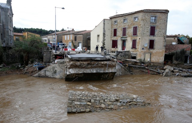 General view of remains of a bridge that was destroyed after flash floods hit the southwestern Aude district of France after several months' worth of rain fell in just a few hours overnight, in Villegailhenc