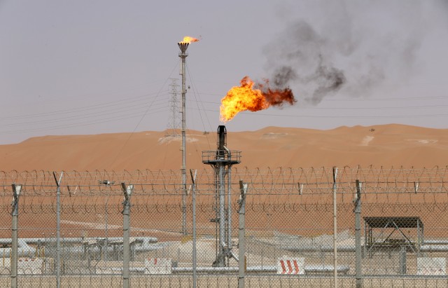 FILE PHOTO: Flames are seen at the production facility of Saudi Aramco's Shaybah oilfield in the Empty Quarter