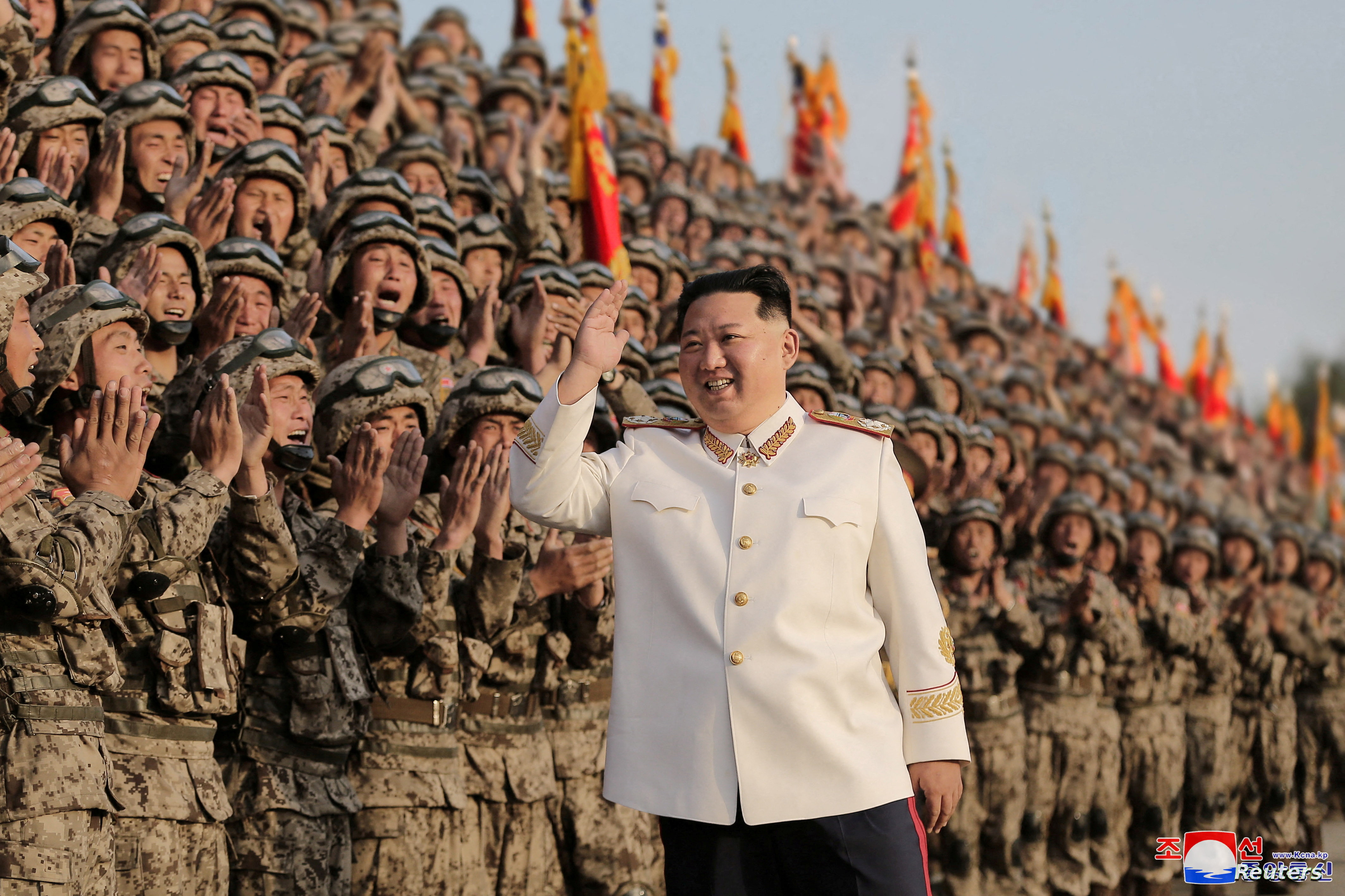 North Korean leader Kim Jong Un meets troops who have taken part in the military parade to mark the 90th anniversary of the founding of the Korean People's Revolutionary Army